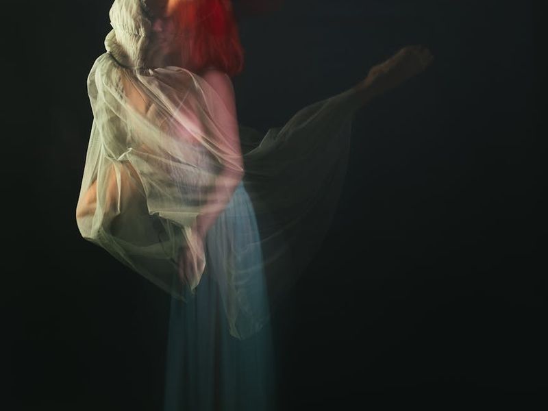 A person captured mid-movement, showing fluidity and grace.